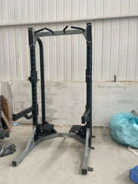 Squat rack with pull up station